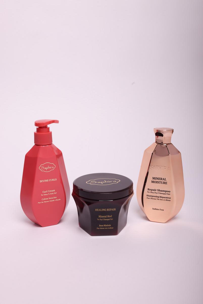 Saphira Divine Curls curl cream, Healing Repair mineral mud, and Mineral Moisture shampoo on a light background
