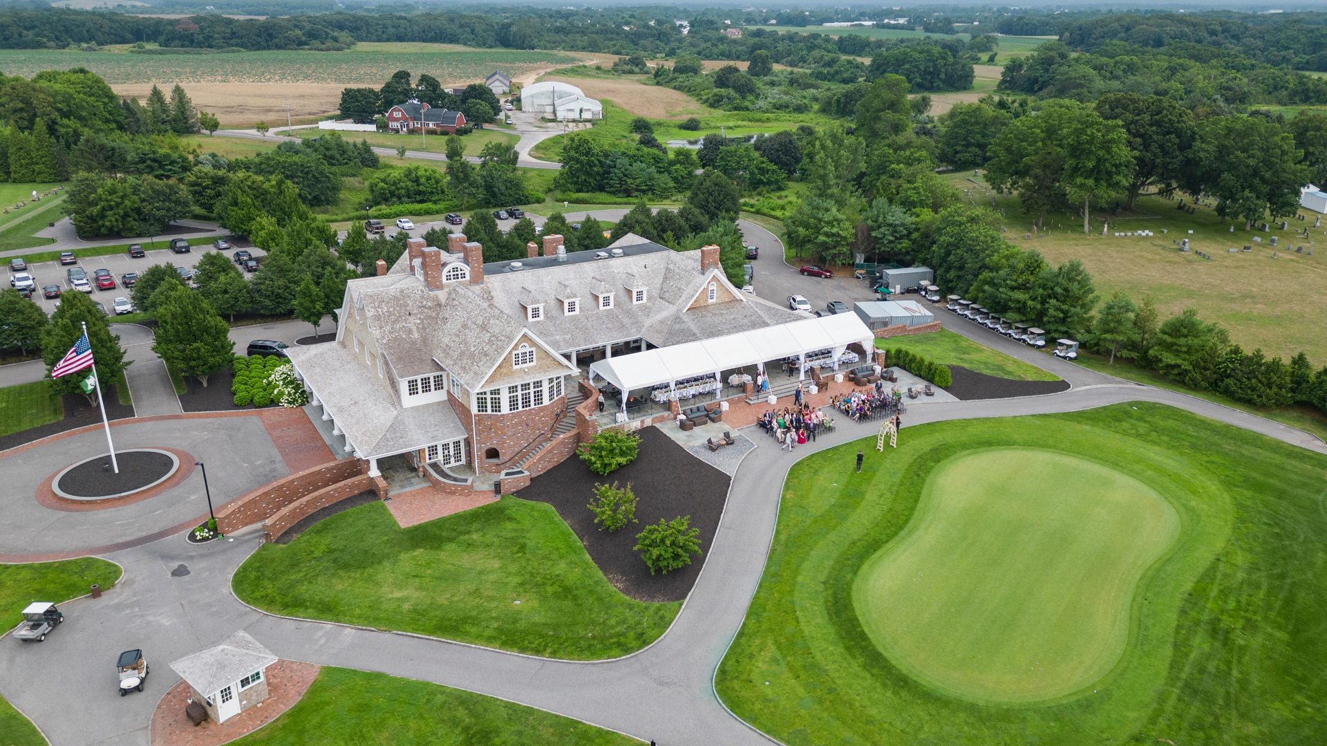Aerial drone view over fog-covered golf course fairways
