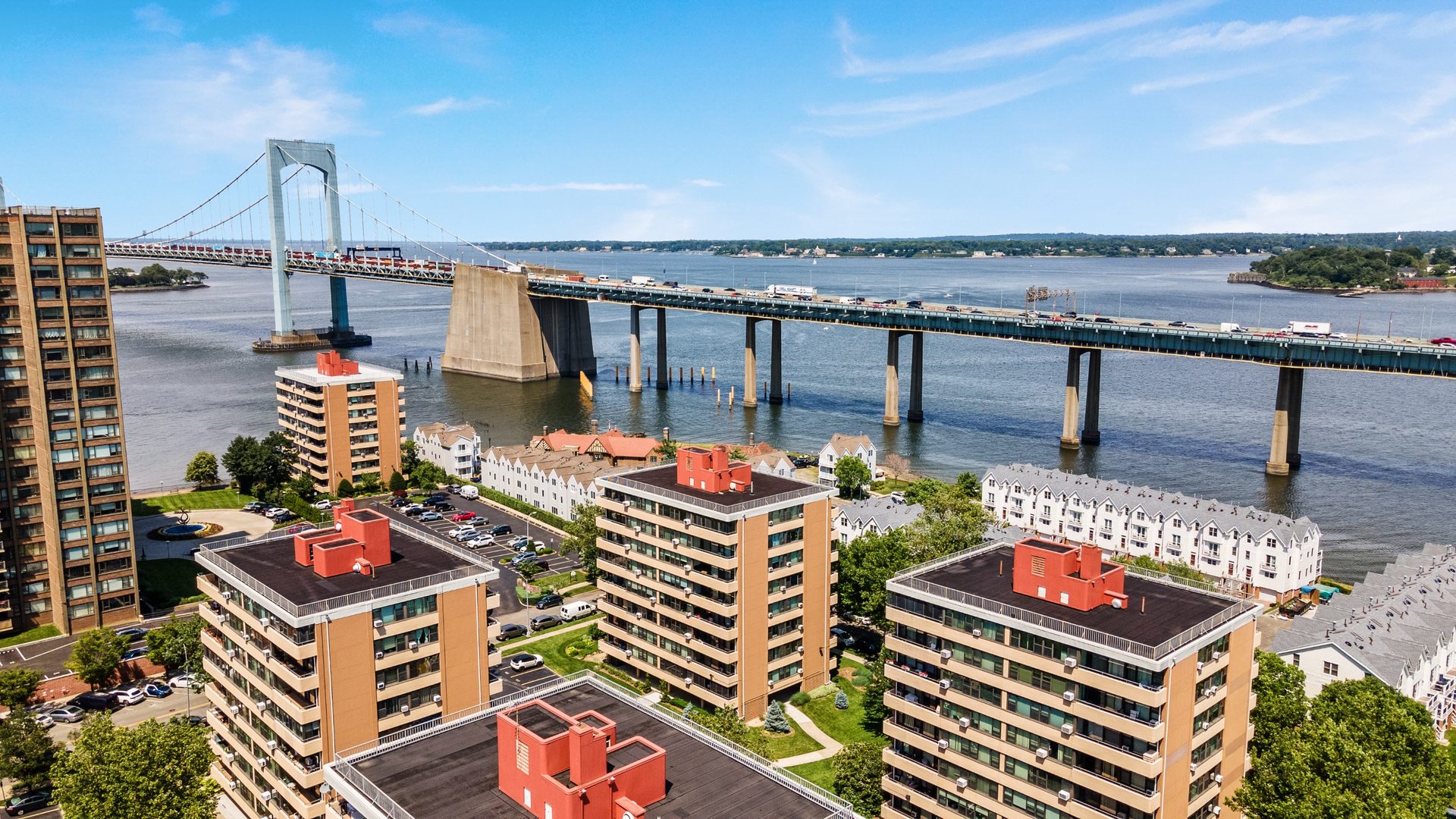 Aerial drone view of a bridge spanning a wide river